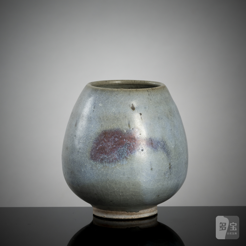 A lotus bud vase with Jun glaze and violet splashes